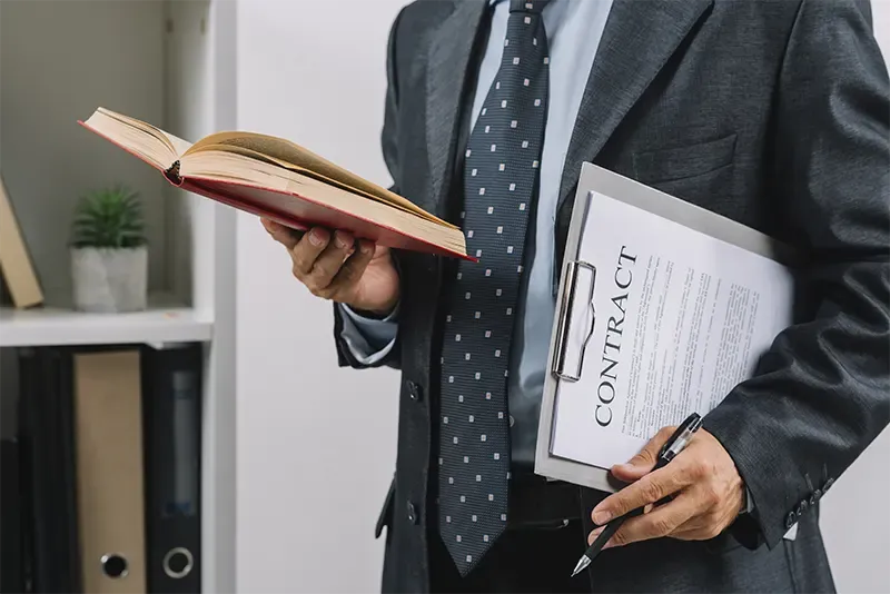 businessman holding book clipboard with contract img