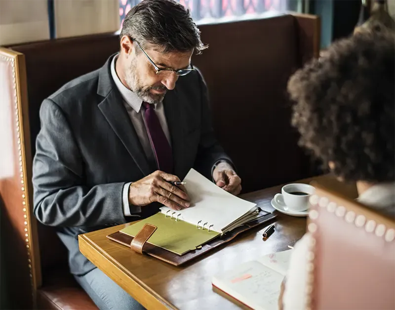 business people discussing cafe img